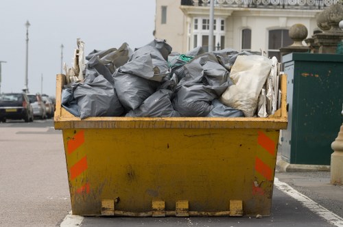 Professional house clearance team removing furniture from a home in Earlscourt